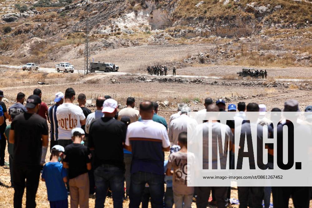 Israeli settlers prevented Palestinian farmers from accessing their agricultural lands in Hebron HEBRON, WEST BANK, PALESTINE - JULY 10: Palestinians perform Friday prayers on land threatened with confiscation by Israel while Israeli settlers, protected by Israeli forces, continue to block roads leading to Palestinian farmers lands in the town of Izna, near Hebron, West Bank, Palestine on July 10, 2026. Wisam Hashlamoun Anadolu Hebron West Bank. Editorial use only. Please get in touch for any other usage.
