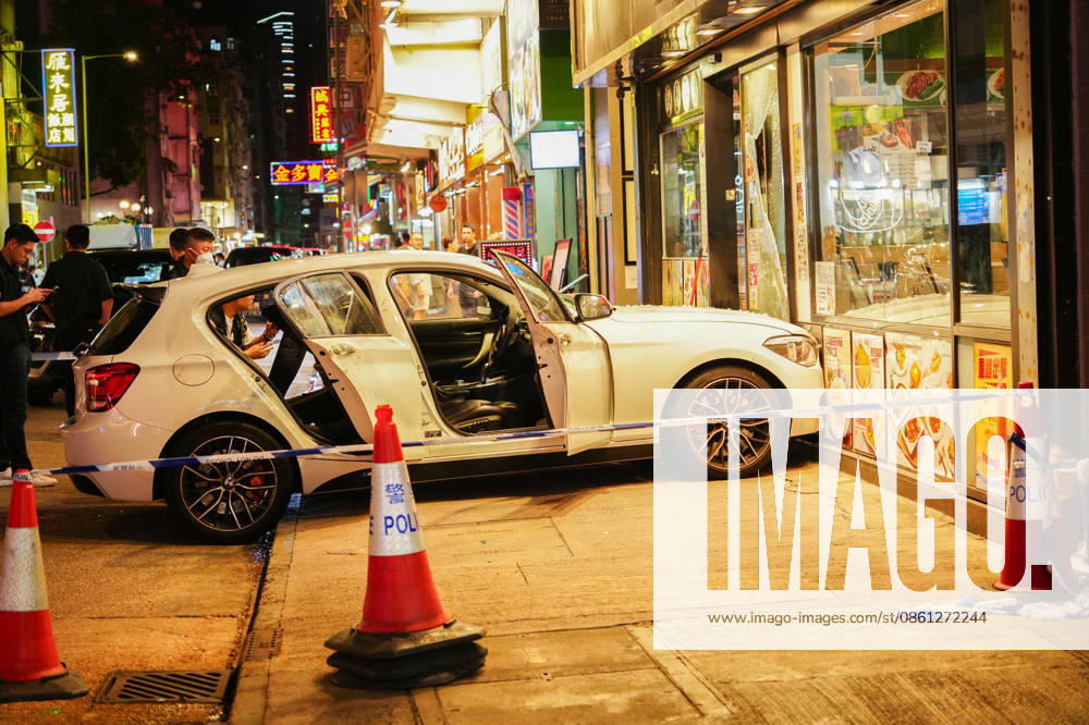 HONG KONG-DAILY MONGKOK-CAR-CRASH A general view from outside the police cordon shows a white private car that crashed into a cafe at the intersection of Portland Street and Shantung Street following a police chase in Mong Kok on July 10, 2026 in Hong Kong. Police arrested two men and seized suspected drugs from the vehicle after it rammed onto the pavement while evading an intercept. (Photo by Zulu Lo TMHK via Nexpher Images) Hong Kong