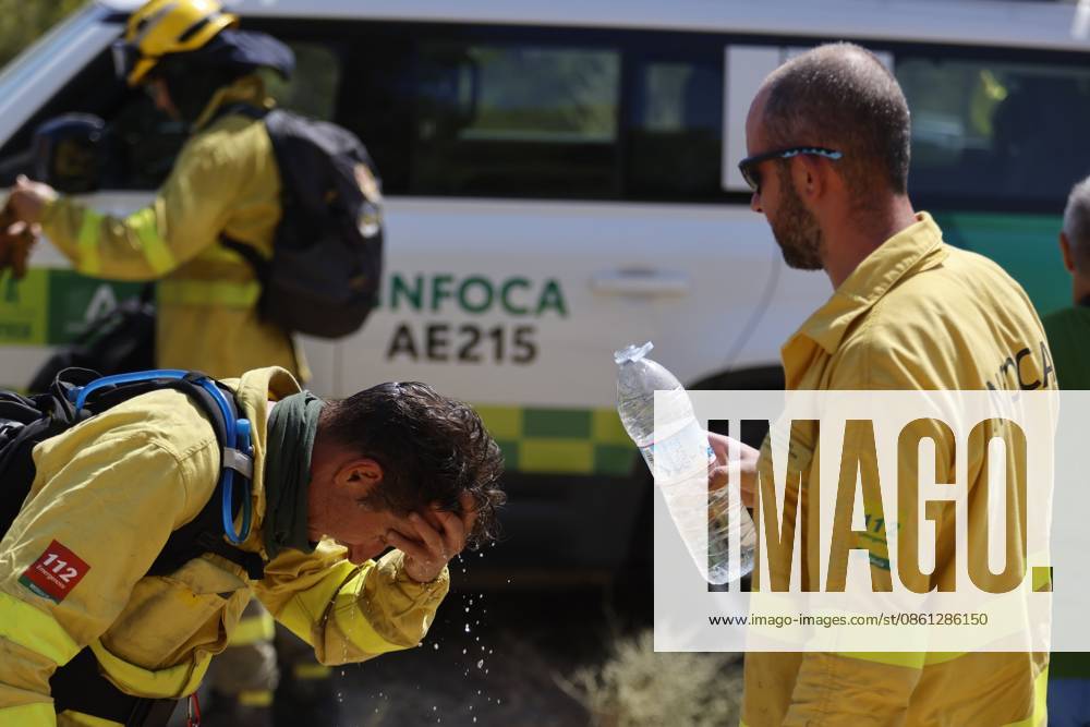 Forest fire kills at least 12 in southern Spain ALMERIA, SPAIN - JULY 10: An exhausted firefighter rests near an INFOCA emergency vehicle while a colleague holds a bottle of water during a massive wildfire while evacuation and firefighting efforts continue in the Los Gallardos district of Almeria, Spain on July 10, 2026. At least 12 people were killed in a forest fire that broke out Thursday in Los Gallardos municipality in Almeria province in Spain’s southern Andalusia region, broadcaster RTVE reported. According to Andalusia’s emergency services, the victims were found in a hamlet of the neighboring municipality of Bedar, with some discovered inside vehicles engulfed by the flames. Pablo Miranzo Anadolu Almeria Spain. Editorial use only