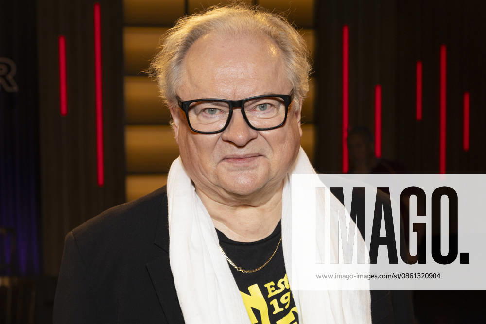 Singer and writer Heinz Rudolf KUNZE, smiling, wearing a white scarf, portrait, appearing as a guest on the TV show Kölner Treff on WDR television, recorded on July 10, 2026, broadcast on August 7, 2026