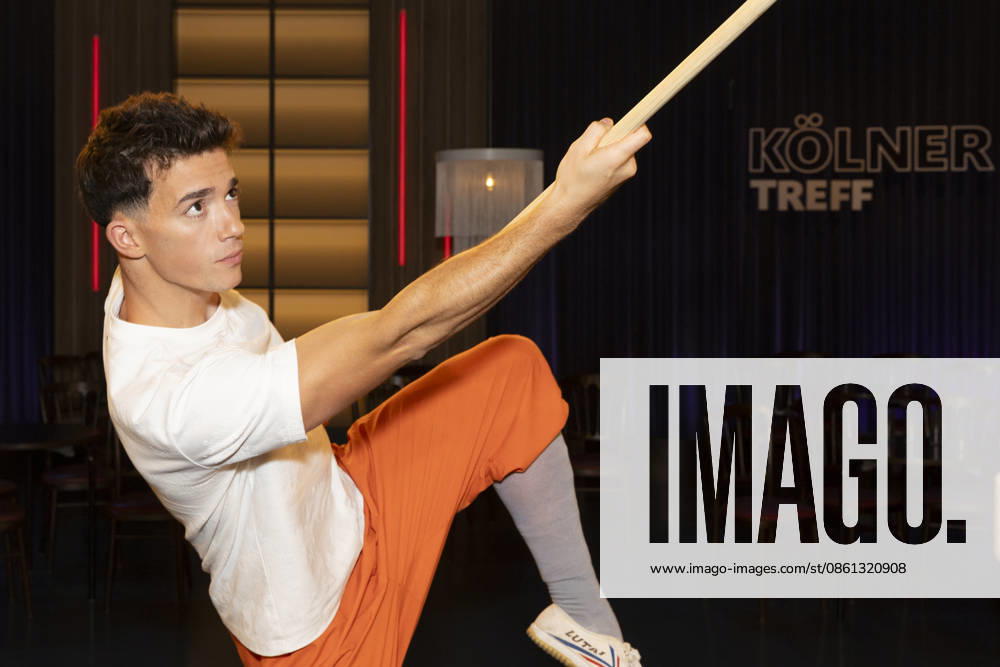 Shaolin Kid Sacha WENK, holding a Bo staff, focused, portrait, guest on the TV show Koelner Treff on WDR television, recorded on July 10, 2026, Aired on August 7, 2026