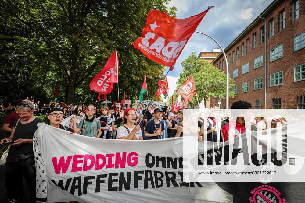 Demonstrators march and chant during an anti-war protest against Rheinmetall and the arms industry in Berlin, Germany, on July 11, 2026. The demonstration called for an end to weapons production and military expansion, with participants carrying banners and Palestinian flags while demanding greater investment in social services instead of armaments. Berlin Germany - ZUMAa268 20260711_zip_a268_009