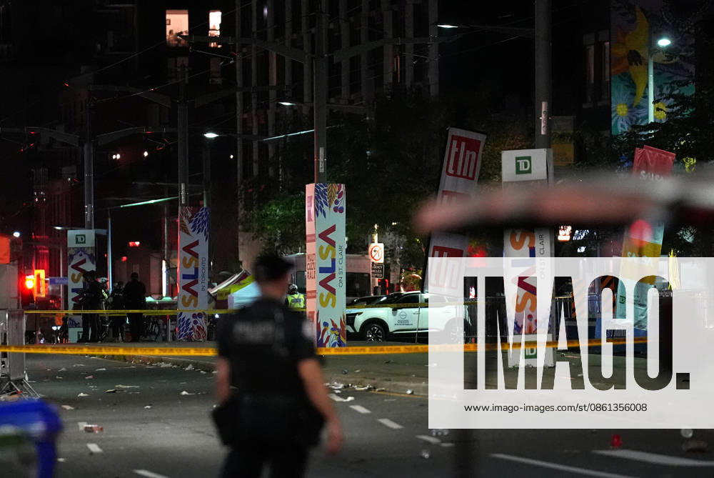 2 killed, 5 wounded in Toronto street festival shooting TORONTO, CANADA - JULY 11 : Toronto Police stand guard on St. Clair Avenue West near Arlington Avenue in Toronto, Ontario, Canada on July 11, 2026. Two people were killed and five wounded in a shooting near Canada s largest Latin street festival Saturday, according to police, who urged the public to avoid the area as officers continued their investigation. Mert Alper Dervis Anadolu Ontario Canada. Editorial use only. Please get in touch for any other usage.