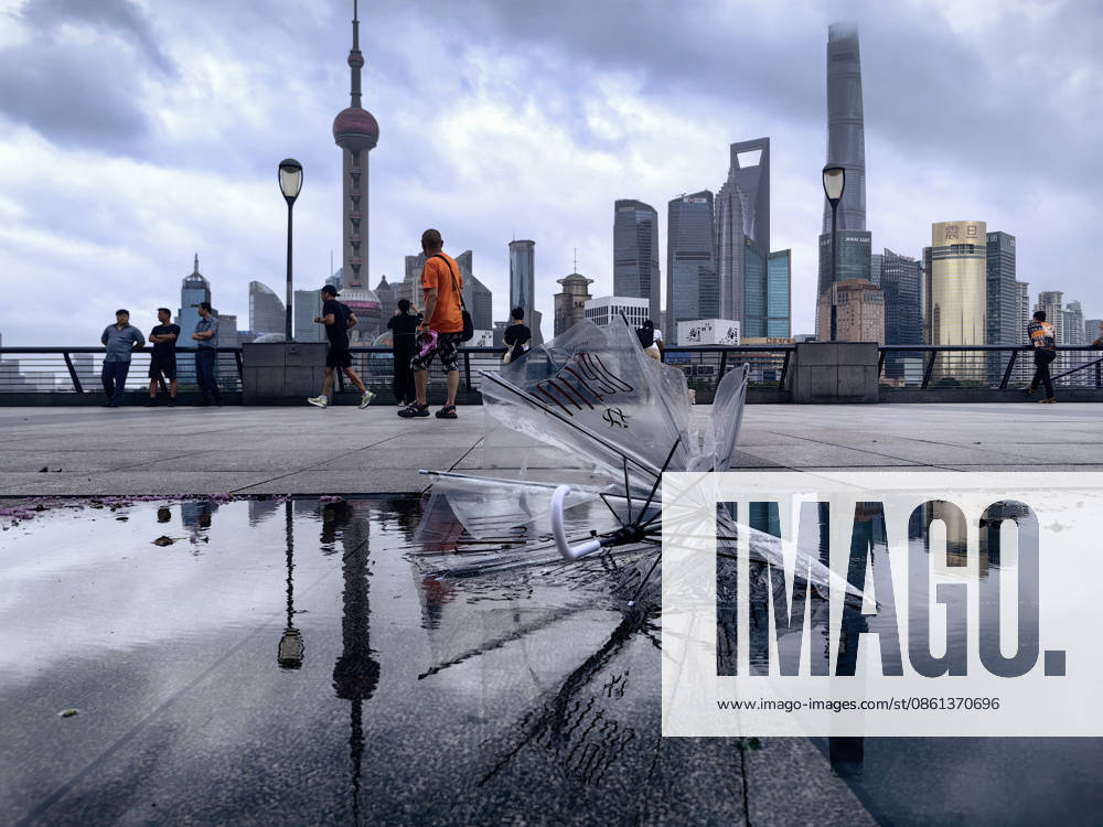 Broken umbrella is seen on the Bund as Typhoon Bavi brings strong wind to city Shanghai on July 12, 2026 in Shanghai, China. The number of tourists decreased significantly due to the severe weather conditions.