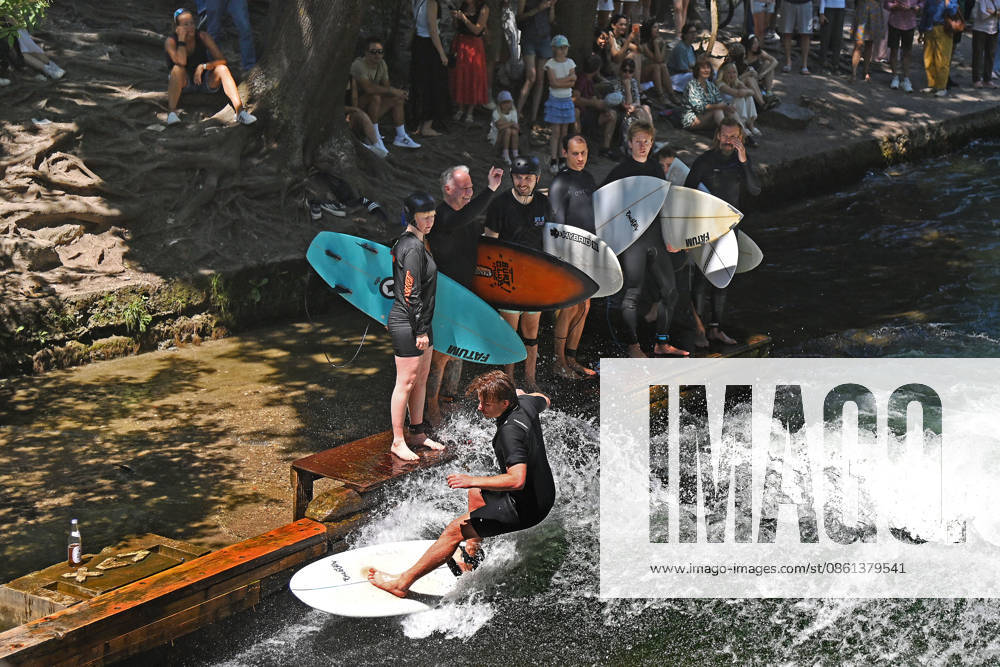 Weather photo from July 12, 2026: Surfers on the Eisbach in Munich. The famous Eisbach wave in Munich’s English Garden is bustling with activity amid perfect summer weather.