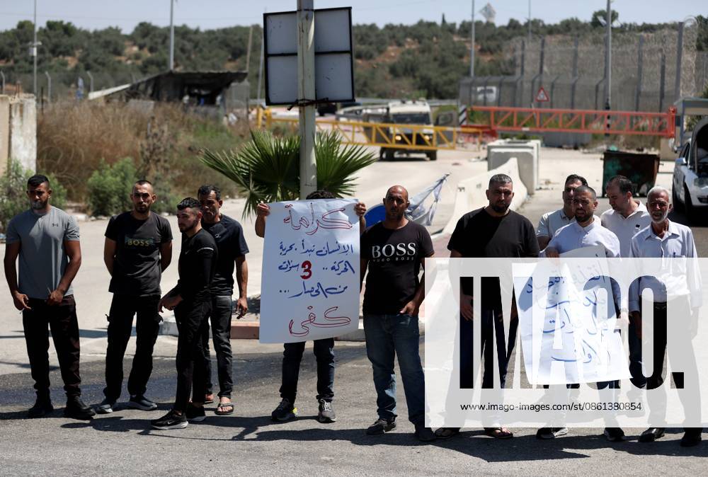Palestinians protest Israeli military blockade at entrance of Azzun town in West Bank QALQILYA, WEST BANK, PALESTINE - JULY 12: Palestinians gather to protest against the ongoing closure of the entrance to Azzun town, located east of Qalqilya in the West Bank, Palestine on July 12, 2026. The Israeli military has kept the town s entrance blocked with military checkpoints and iron barricades since October 7, 2023, severely disrupting the daily lives of local residents. Issam Rimawi Anadolu Qalqilya West Bank. Editorial use only. Please get in touch for any other usage.