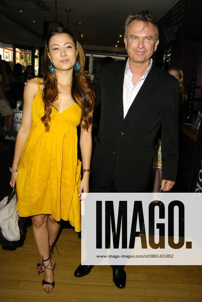 UK Film Premiere of Little Fish , SAM NEILL & DAUGHTER At the UK Film Premiere of Little Fish , Curzon Soho, London, England, 16th July 2006. full length father daughter family yellow mustard dress Ref: CAN Can Nguyen London Great Britain