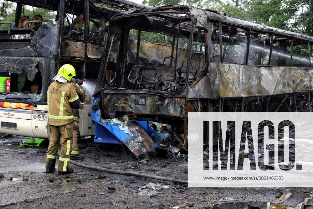A firefighter with the State Emergency Service of Ukraine extinguishes smoldering debris at a bus depot destroyed in a Russian attack in Odesa, Ukraine, on July 13, 2026. Russian forces launched a missile and drone attack on the city on the morning of July 13, damaging a transport company, private houses and a sanatorium building. Four people, including a five-year-old girl, were injured (Photo by Nina Liashonok Ukrinform) Russian attack damages bus depot in Odesa