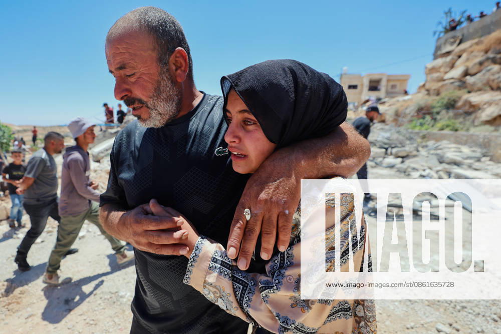 Hebron West Bank Home Demolition A Palestinian man comforts a woman near the rubble of the demolished home of Osama Masaaf s family in Al-Deirat, south of Hebron, occupied West Bank on July 14, 2026. Israeli forces demolish the house on the grounds that it lacked an Israeli-issued building permit, displacing the family of eight. Hebron West Bank Palestinian Territories