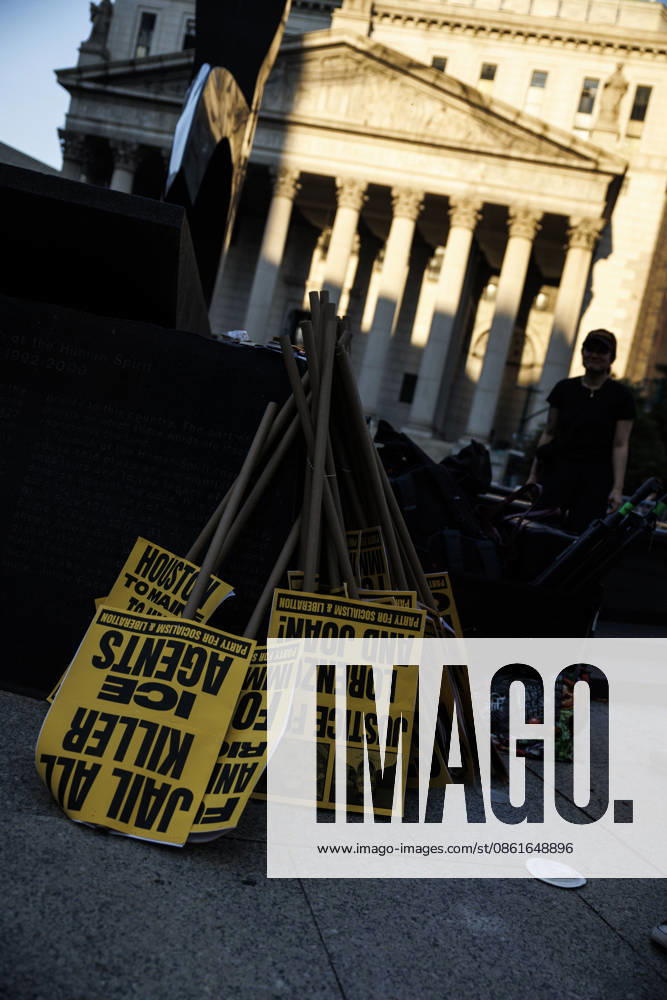 Signs are seen during a protest. Protesters gather and demand justice for Lorenzo Salgado Araujo, 52, a man shot and killed by Immigration and Customs Enforcement (ICE). Protesters call for a full investigation into the fatal shooting and demand an end to local collaboration with ICE. New York USA - ZUMAh182 20260714_znp_h182_010