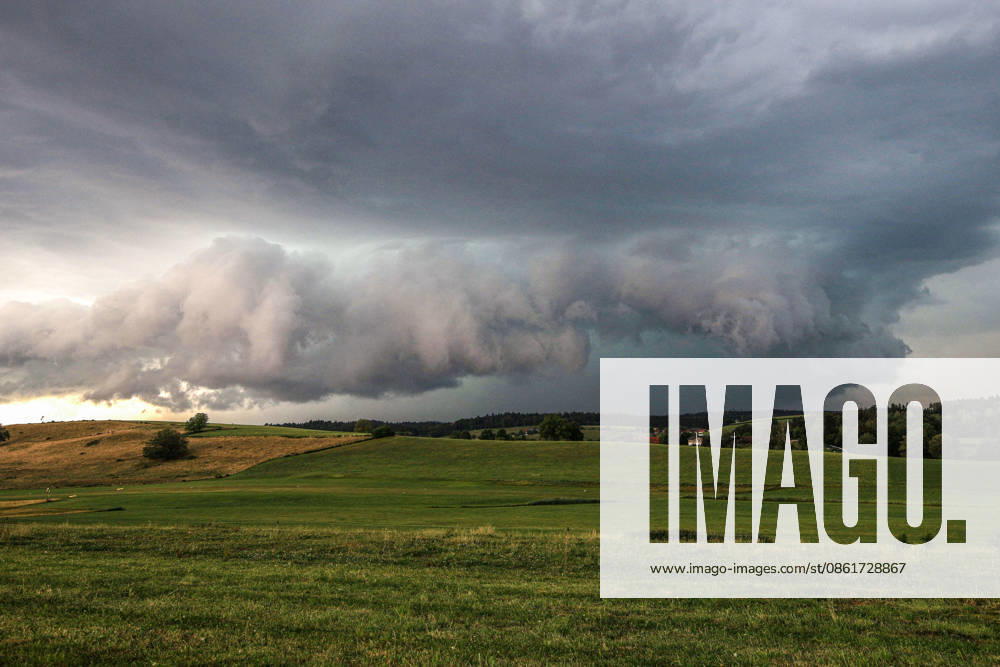 A menacing storm scene over the Lake Constance region: A massive thunderstorm cell is building over Sigmarszell in the Bavarian district of Lindau on Lake Constance. The imposing cloud formation heralds a severe storm with heavy rain, gusts of wind, and possible hail, and dramatically dominates the sky over the Sigmarszell region in Bavaria, Germany. Sigmarszell