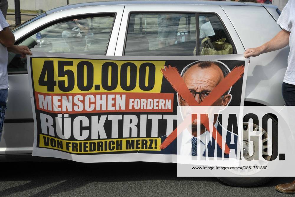 ABB BPK protesters with petitions and a banner reading 450,000 people demand Friedrich Marz s resignation in front of the Chancellery on July 15, 2026, in Berlin, Germany
