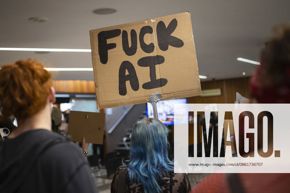 People in opposition to AI data centres demonstrate outside the council chambers at city hall in Hamilton, Wednesday, July 15, 2026. Hamilton Canada - ZUMAc35_ 20260715_zaf_c35_032