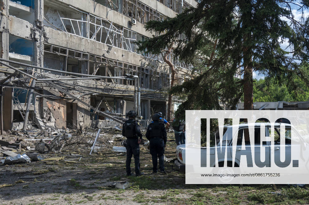 KW29 Russian guided bomb strike damages industrial zone in Kharkiv KHARKIV, UKRAINE - JULY 15: The aftermath of a strike by a Russian guided aerial bomb is seen in an industrial zone in Kharkiv, Ukraine, on July 15, 2026. The attack caused severe damage to industrial buildings housing woodworking, footwear and clothing manufacturing facilities, as well as other civilian enterprises. Seven vehicles parked near the impact site were also damaged. According to local authorities, eight civilians were injured in the strike. Men aged 44, 49, 50 and 57, along with women aged 31, 51 and 60, were hospitalized with injuries of varying severity. A 51-year-old man who suffered cuts from shattered glass received medical treatment at the scene. Serhii Masin