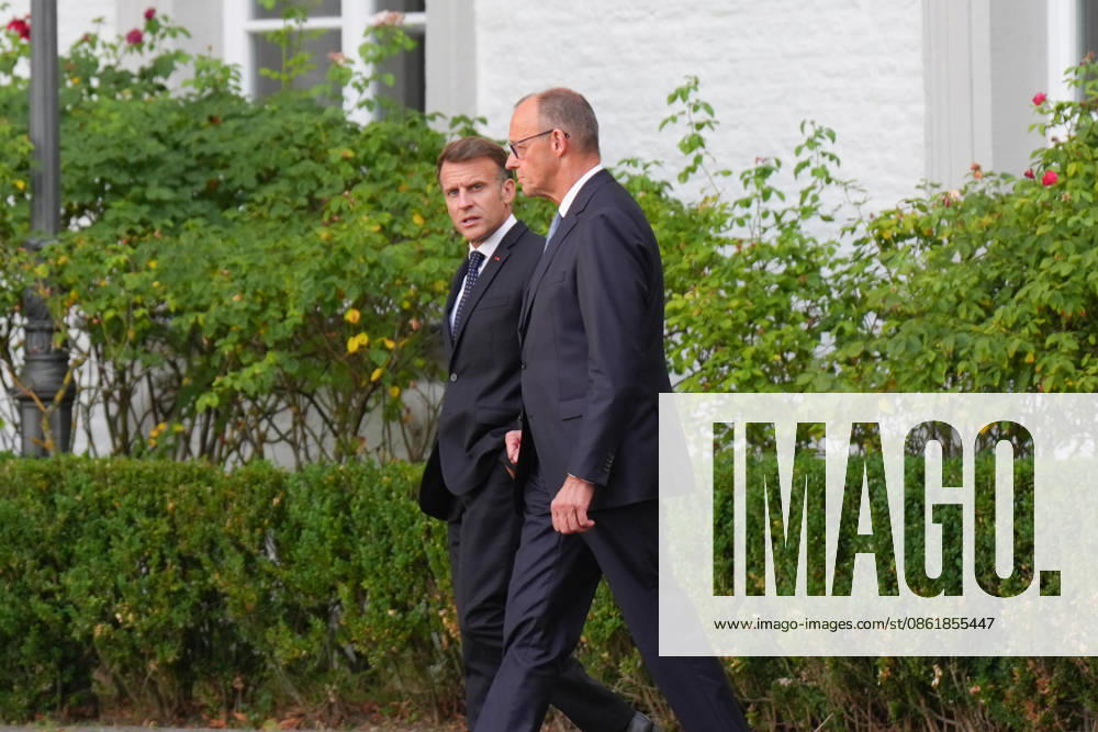 Visit by the French President to Federal Chancellor Merz in Bensberg Federal Chancellor Friedrich Merz walks with French President Emmanuel Macron through the hotel’s entrance area prior to the delegation meeting in the Salon Medici at the Schlosshotel Bensberg, Bensberg, July 16, 2026, Bensberg, North Rhine-Westphalia, Germany
