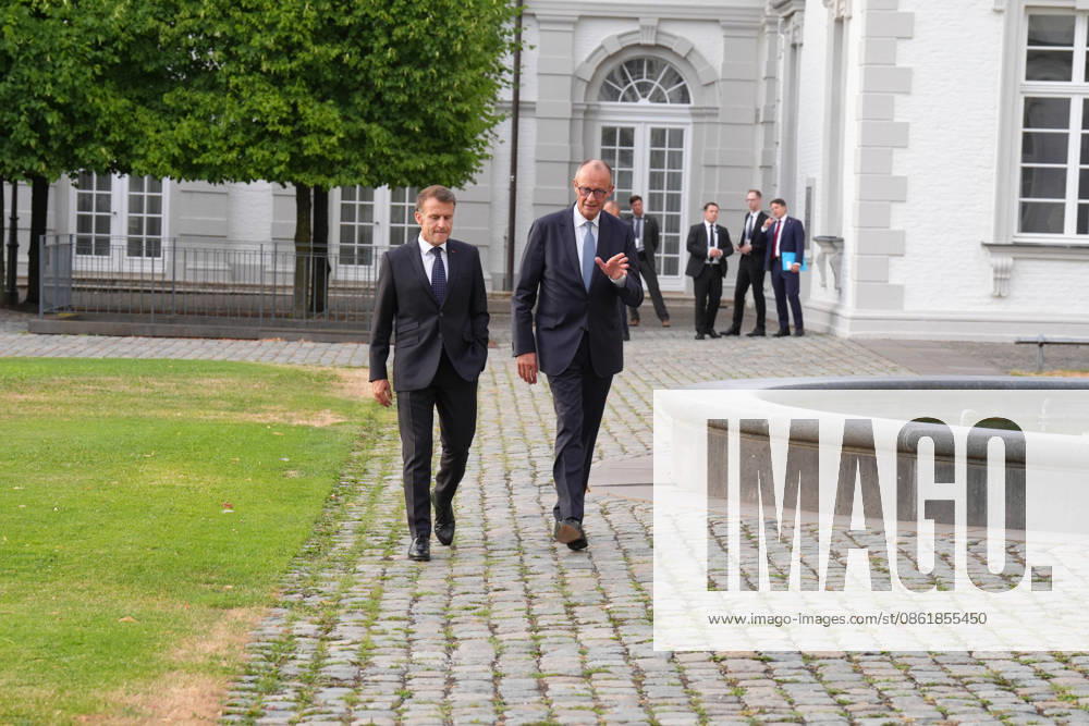 Visit by the French President to Federal Chancellor Merz in Bensberg Federal Chancellor Friedrich Merz walks with French President Emmanuel Macron through the hotel’s entrance area prior to the delegation meeting in the Salon Medici at the Schlosshotel Bensberg, Bensberg, July 16, 2026, Bensberg, North Rhine-Westphalia, Germany