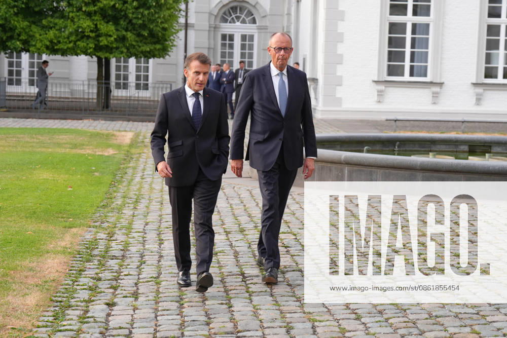 Visit by the French President to Federal Chancellor Merz in Bensberg Federal Chancellor Friedrich Merz walks with French President Emmanuel Macron through the hotel’s entrance area prior to the delegation meeting in the Salon Medici at the Schlosshotel Bensberg, Bensberg, July 16, 2026, Bensberg, North Rhine-Westphalia, Germany