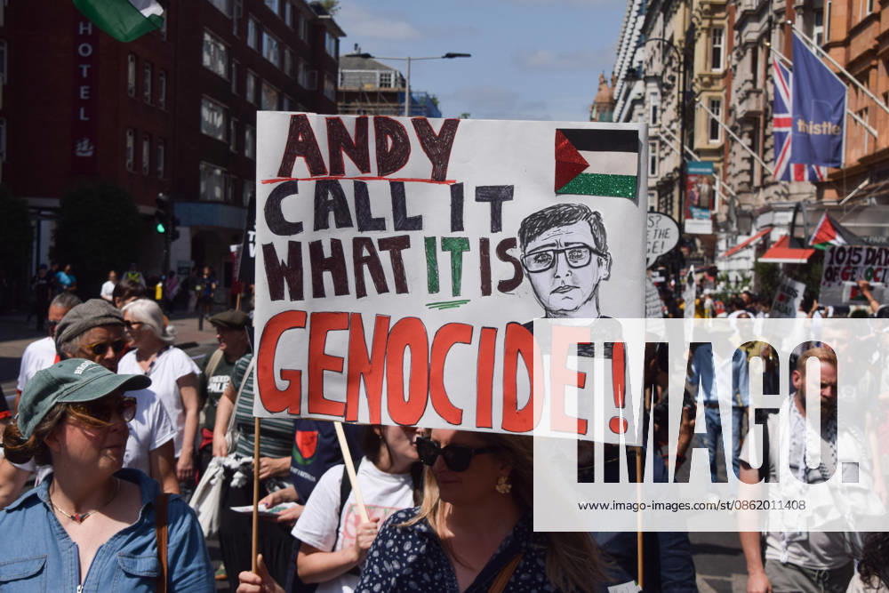 A protester urges the incoming Prime Minister Andy Burnham to call it genocide as thousands of people march in support of Palestine. London United Kingdom - ZUMAv130 20260718_zip_v130_038