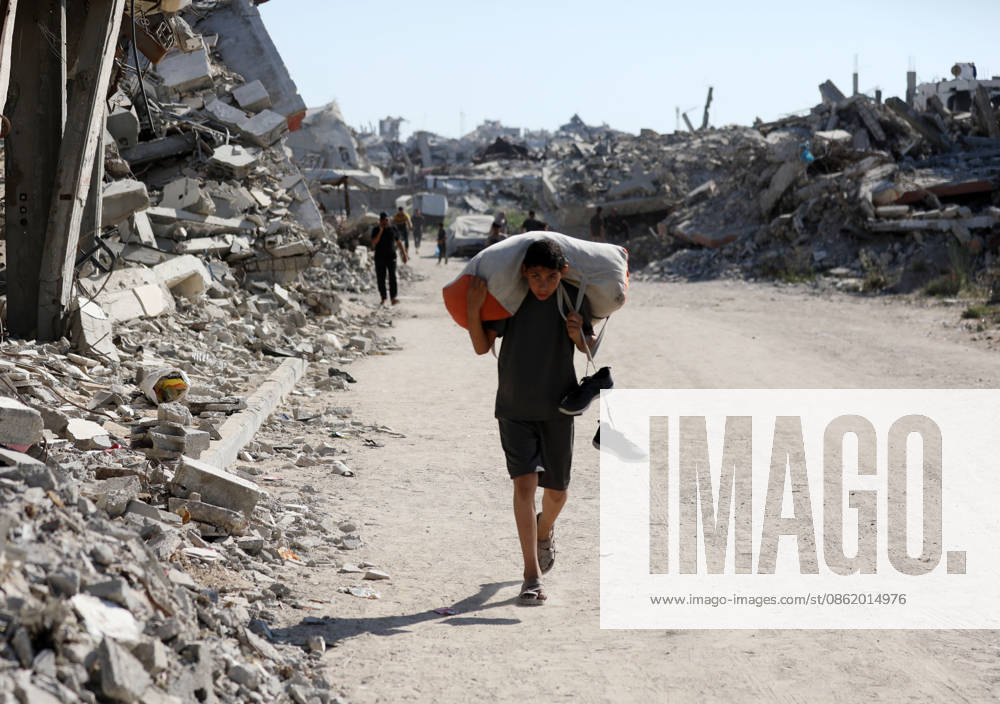 Displaced Palestinians leave tents in Gaza City’s al-Zeitoun neighborhood Displaced Palestinians carry their belongings as they leave their tents in the al-Zeitoun neighborhood of Gaza City on July 18, 2026. The departure follows the Israeli army’s expansion of the so-called Yellow Line, where its forces are deployed, through the placement of new concrete barriers and warnings of attacks in the area, in what residents described as a violation of the ceasefire. Photo by Bilal Osama apaimages Gaza city Gaza Strip Palestinian Territory 180726_Gaza_BO_02(1)