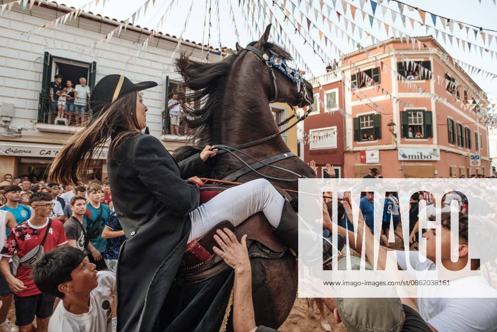 A caixer, or horse rider, rears his horse amid a cheering crowd during the traditional Jaleo at the Sant Marto Festival in Es Mercadal. Es Mercadal Spain - ZUMAo105 20260718_fap_o105_001