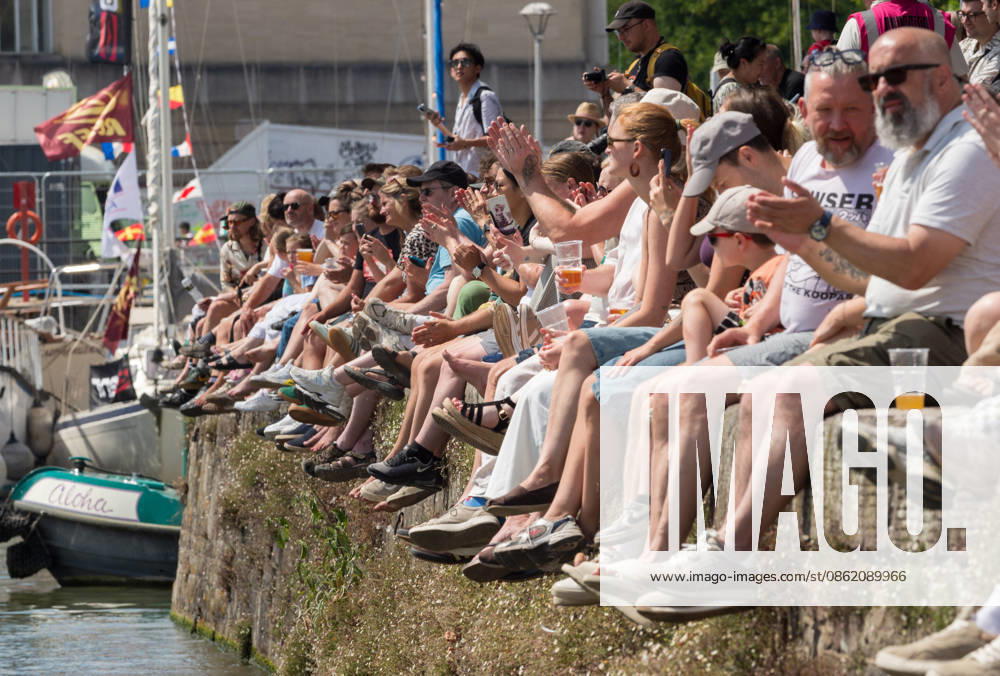 Bristol, UK. Crowds throng the harbourside at Bristol Harbour Festival in warm weather at the end of the latest summer heatwave in the UK. The event includes maritime displays and boats and ships with music, circus and other performances. Bristol UK - ZUMAl94_ 20260719_zaf_l94_002