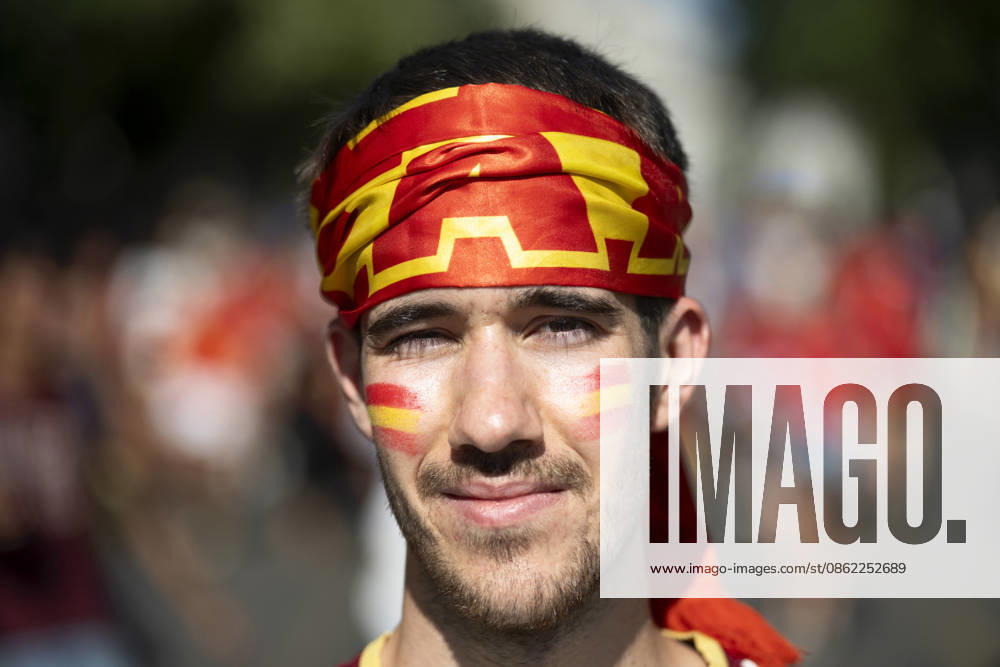 A portrait of a young Spanish football fan wearing a red and yellow headband and national flag face paint during the team s World Cup victory parade. An estimated two million people flooded the capital s streets to welcome the squad following their 1-0 win against Argentina in the 2026 FIFA World Cup final. Madrid Spain - ZUMAs197 20260720_aaa_s197_442