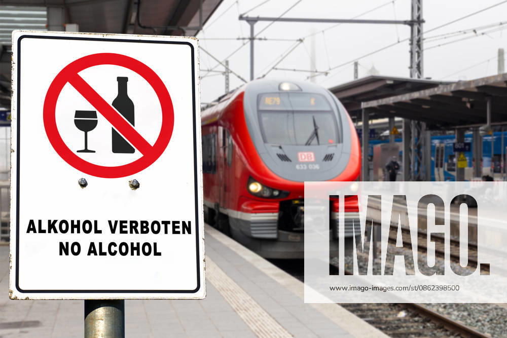 PHOTO MONTAGE, DB train with a sign reading: KEIN ALKOHOL, NO ALCOHOL! Deutsche Bahn (DB) is gradually introducing a nationwide ban on alcohol consumption at its train stations. The ban applies to platforms and station concourses, but not to restaurants and bars