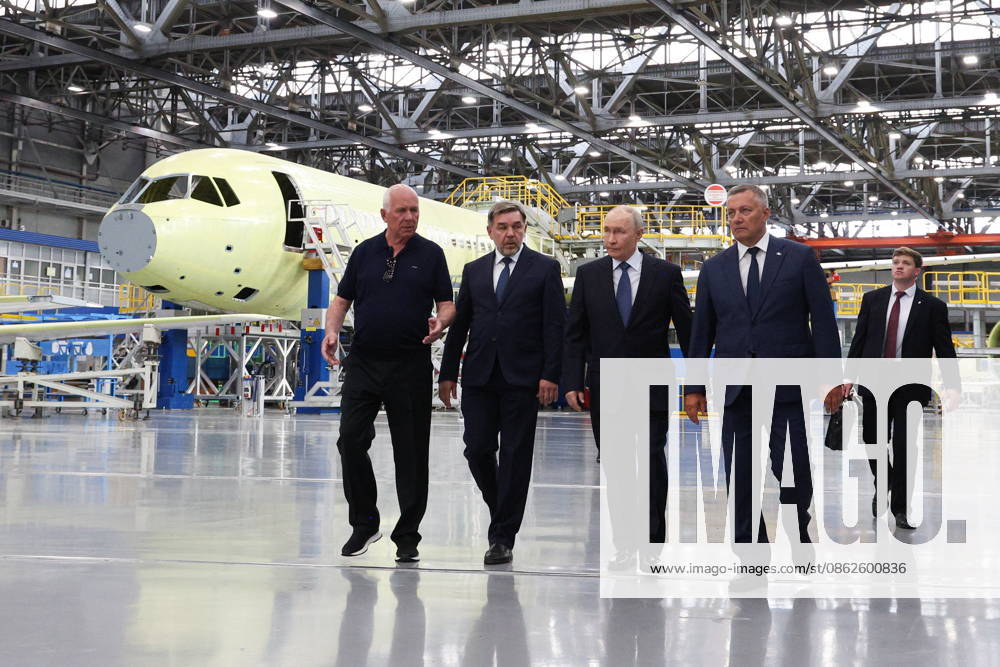 RUSSIA, IRKUTSK - JULY 24, 2026: Sergei Chemezov, Rostec CEO, Andrei Soinov, Irkutsk Aviation Plant CEO, Vladimir Putin, President of Russia, and Igor Kobzev (L-R front), Irkutsk Region Governor, visit the Irkutsk Aviation Plant owned by Rostec s United Aircraft Corporation. Vyacheslav Prokofyev Russian Presidential Press and Information Office TASS 95394736