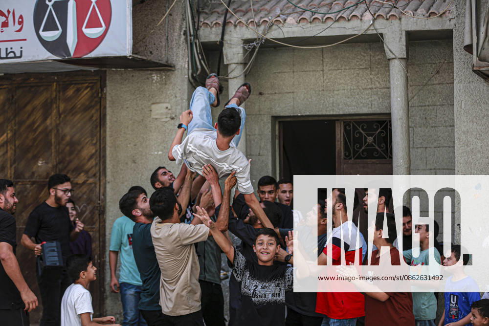 Gaza Families Celebrate Tawjihi Success Palestinian men toss a young man into the air during celebrations of the Tawjihi results in Gaza City, northern Gaza Strip, on July 23, 2026. Families in displacement camps and neighborhoods across northern Gaza City held modest celebrations for students who passed the Tawjihi examinations amid war, blockade and severe humanitarian conditions. Gaza Gaza Strip Palestinian Territories