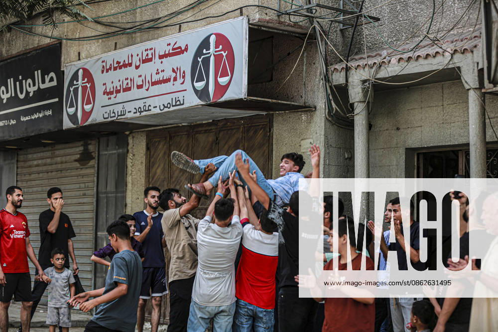 Gaza Families Celebrate Tawjihi Success Palestinian men and boys lift a young man above the crowd during celebrations of the Tawjihi results in Gaza City, northern Gaza Strip, on July 23, 2026. Families in displacement camps and neighborhoods across northern Gaza City held modest celebrations for students who passed the Tawjihi examinations amid war, blockade and severe humanitarian conditions. Gaza Gaza Strip Palestinian Territories