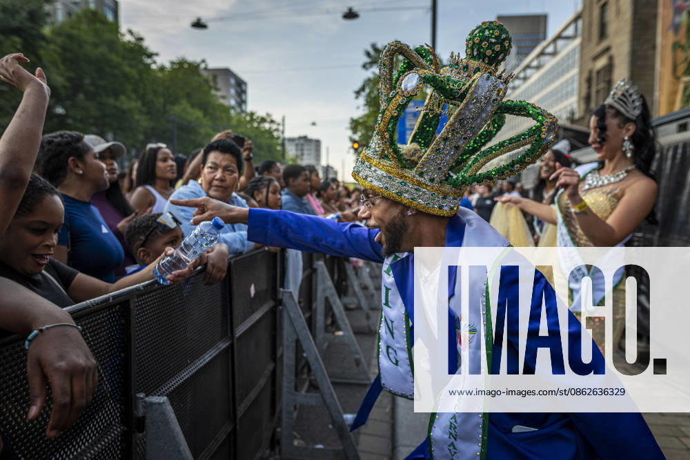 24 July 2026, Rotterdam, the Netherlands. The ZomerCarnaval king and queen dance and interact with the crowd. Competing in the Battle of Drums, three brass band groups†Rhythm Allstars Brass Band, S.L.R. Brass Band, and Latin Music Brass Band†perform during the Battle of Drums. This is the opening event of Rotterdam Unlimitedâ€⠢s Zomercarnaval 2026. Rotterdam Netherlands - ZUMAp202 20260724_zip_p202_014