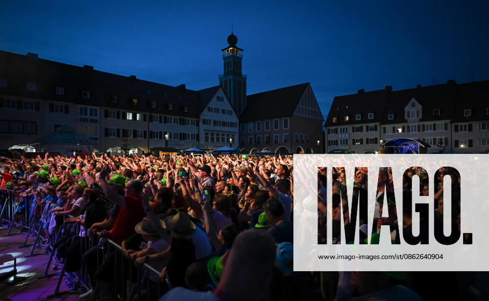 Freudenstadt, July 24, 2026: Black Forest Air Open Air Festival on the Market Square—overview, spectators, and fans create a lively atmosphere on the Market Square with the town hall tower in the background; headliner: DJ Oetzi with his band