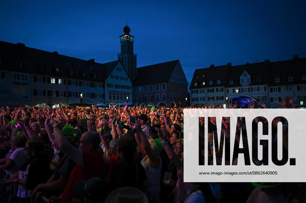Freudenstadt, July 24, 2026: Black Forest Air Open Air Festival on the Market Square—overview, spectators, and fans create a lively atmosphere on the Market Square with the town hall tower in the background; headliner: DJ Oetzi with his band