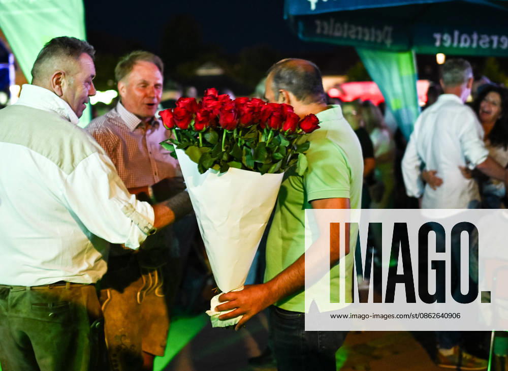 Freudenstadt, July 24, 2026: Black Forest Air Open Air Festival on the Market Square. A rose vendor on the sidelines of the main act, DJ Oetzi