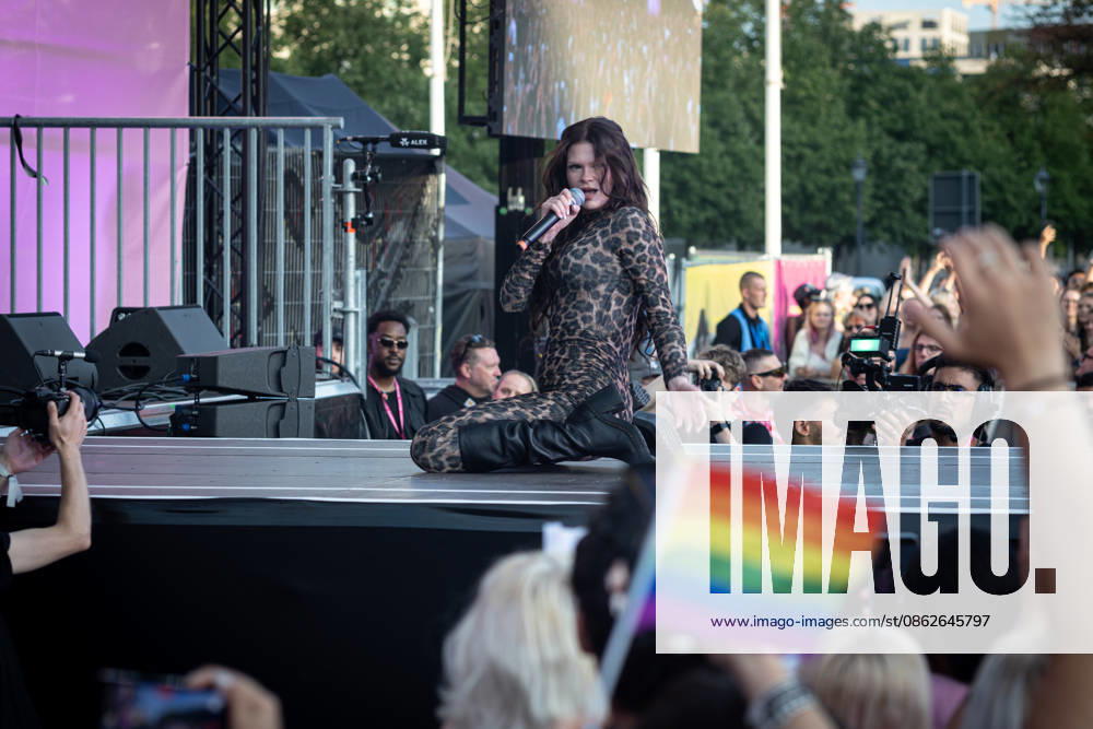 Berlin-based rapper Ikkimel performs on stage in front of an LGBT flag during the Democracy Evening? rally at the Brandenburg Gate on the opening day of Christopher Street Day (CSD). Christopher Street Day (CSD) is Berlins annual Pride demonstration for the rights and visibility of lesbian, gay, bisexual, transgender, intersex and other queer people. Its name refers to Christopher Street in New York City, where resistance to a police raid at the Stonewall Inn in June 1969 sparked several days of protests and became a landmark in the modern LGBTQ+ rights movement..Berlin held its first Christopher Street Day in West Berlin on June 30, 1979. Around 450 people joined the demonstration under the slogan - ZUMAs197 20260724_aaa_s197_348