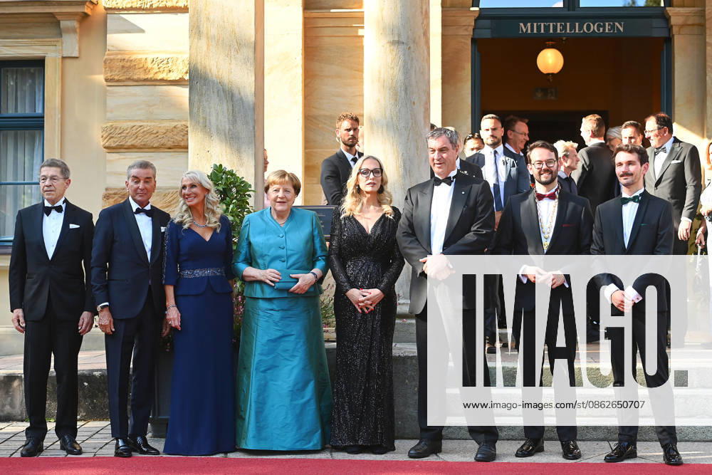 From left: Joachim SAUER, Michel FRIEDMANN, Karin BAUMUELLER SOEDER, Angela MERKEL, Katharina WAGNER, Markus SOEDER, Minister-President of Bavaria and CSU Chairman, Mayor Andreas ZIPPEL and his partner, opening of the 2026 Bayreuth Richard Wagner Festival, Red carpet on July 25, 2026, at the Green Hill,