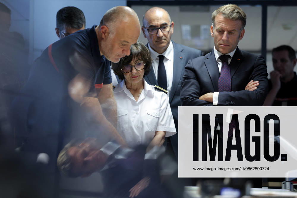 President Macron At Situation Briefing in the Crisis Room - Bordeaux France s President Emmanuel Macron (R), France s Interior Minister Laurent Nunez (centre back) and Prefect of the Centre Val de Loire region Sophie Brocas (2L) listen to SDIS 33 Fire and Rescue Service Departemental director Marc Vermeulen (R) during a situation briefing in the crisis room at the Departmental Fire and Rescue Operational Center (CODIS) in Bordeaux, following wildfires in the area, southwestern France, on July 27, 2026. France has been battered by three heatwaves since May as part of increasingly common extreme weather episodes linked to climate change, causing excess deaths, drying up rivers and fuelling wildfires. Scientists have long warned that climate c