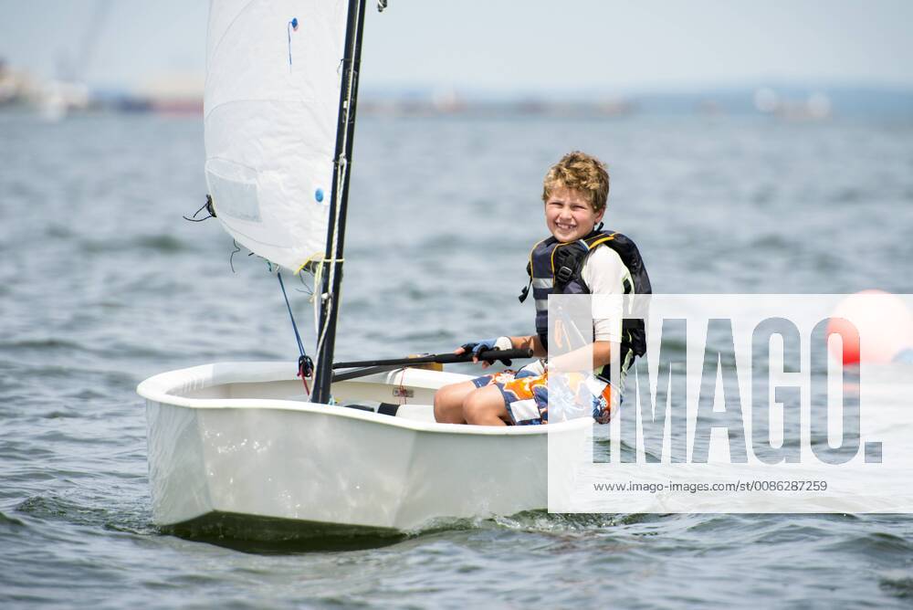 Smiling Teenage Boy Enjoying On Narragansett Bay In Summer Junior Sailing Program, North Kingstown Rhode Island United States model released Symbolfoto