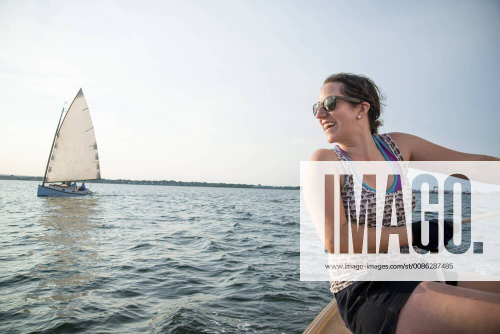 Smiling woman enjoying sailing on Narragansett Bay, North Kingstown Rhode Island United States model released Symbolfoto