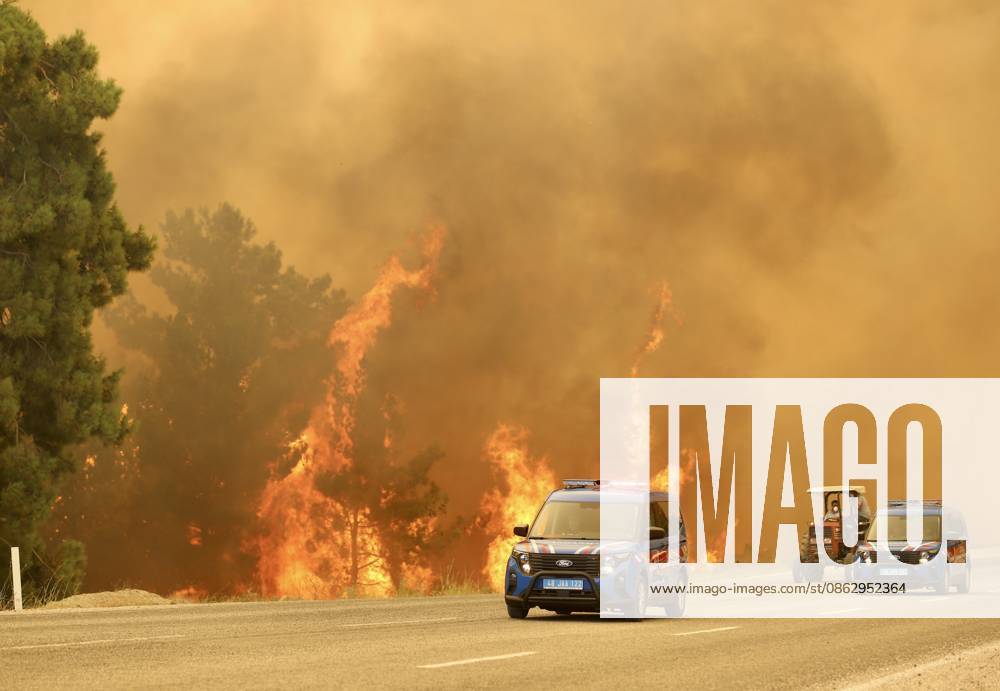 Firefighters battle wildfire in Mugla from air and ground MUGLA, TURKIYE - JULY 29: Fire crews and emergency vehicles operate along the Fethiye-Antalya highway as thick smoke from a forest fire reduces visibility in the Seydikemer district of Mugla, on July 29, 2026 in Mugla, Turkiye. Firefighting teams are battling the blaze from the air and on the ground. The highway was closed to traffic due to the fire and dense smoke affecting the area. Ali Riza Akkir Anadolu Mugla Turkey. Editorial use only. Please get in touch for any other usage.