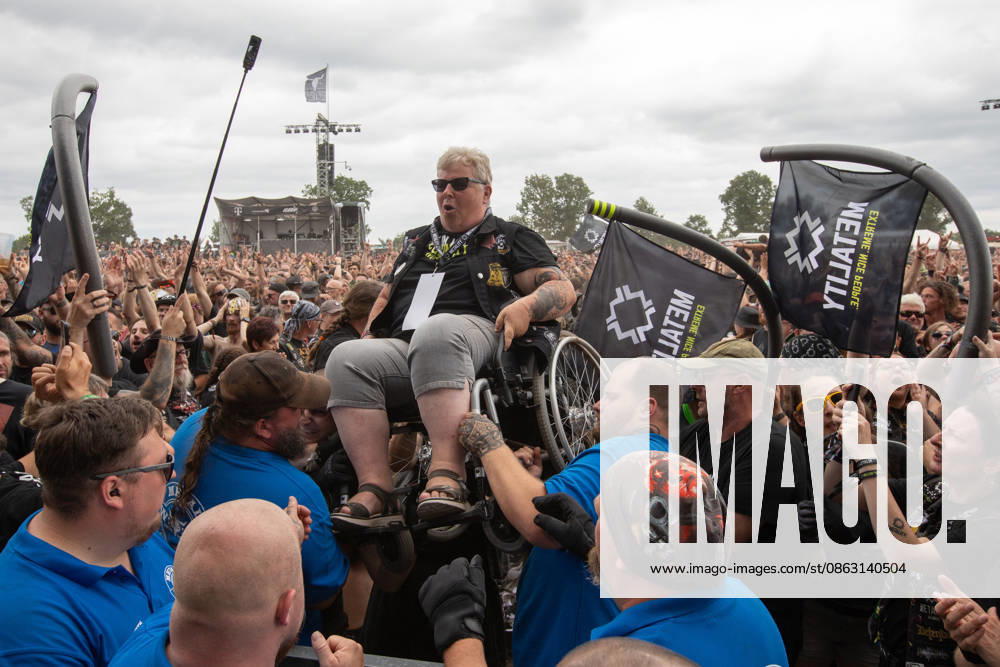 The 35th Wacken Open Air: Friday, Headliner Day, and Friday is Flyday, when people with disabilities—including those in wheelchairs—crowdsurfed. With temperatures that were almost mild, Friday at the Wacken Open Air once again broke all records. All day long, fans waited not only for Judas