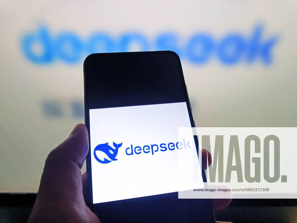DeepSeek SUQIAN, CHINA - AUGUST 5, 2026 - A netizen is using his mobilephone to view DeepSeek logo and using his computer to view DeepSeek webpage in Suqian, Jiangsu, China on August 5, 2026. Suqian Jiangsu China