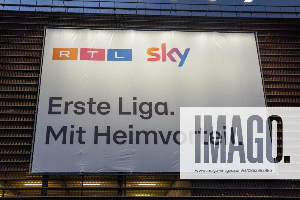 Large-scale advertising banner from RTL and Sky featuring the slogan First Division with Home-Field Advantage in Cologne —a symbolic image representing TV broadcast rights, the Bundesliga, sports broadcasting, and soccer media