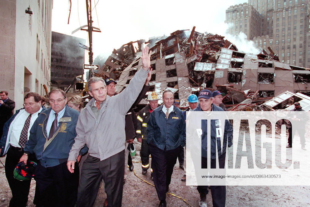 U.S. President George W. Bush waving while touring 7 World Trade Center disaster site with (from left) New York Congressman Jerrold Nadler, Director of New York Cityâ€⠢s Office of Emergency Management Richard J. Sheirer, U.S. from New York Senator Hillary Rodham Clinton, New York Governor George Pataki, New York Fire Department Commissioner Thomas Von Essen, U.S. Senator from New York Chuck Schumer, New York City Mayor Rudolph Giuliani and Chief of Staff Joe Hagin, Financial District, Manhattan, New York City, New York, USA, Paul Morse, George W. Bush White House Photo Office, September 14, 2001 New York City USA - ZUMAg145 20010914_zap_g145_004