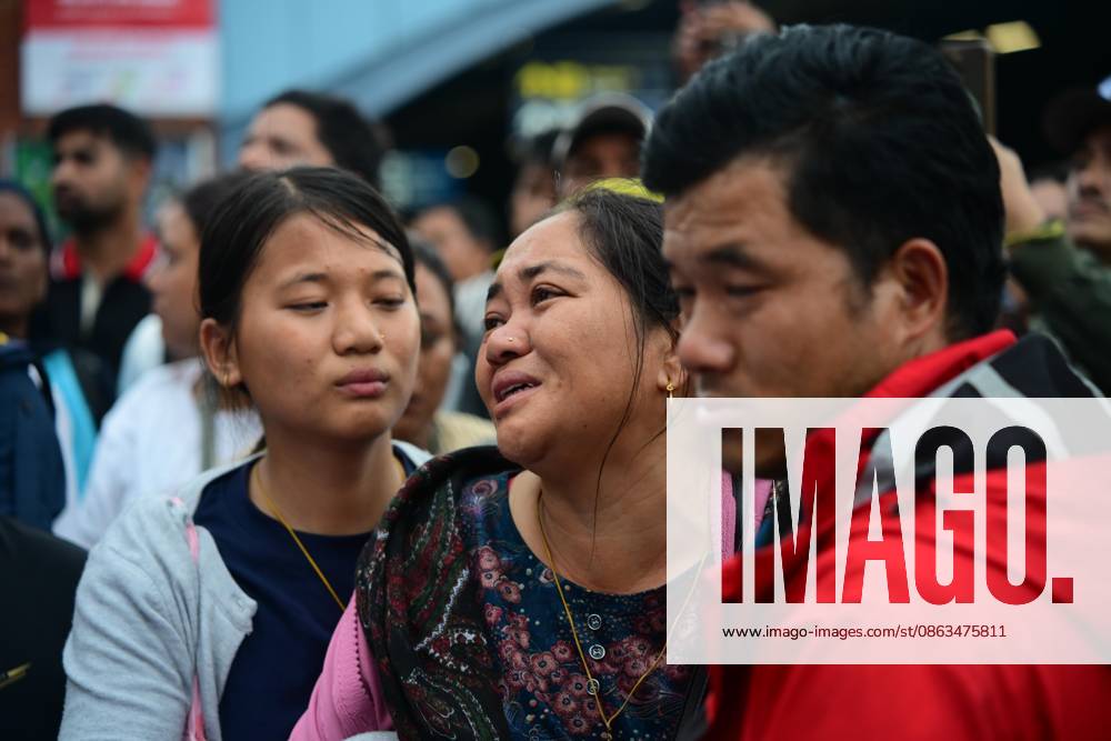 Relatives of veteran Nepali mountaineer Pur Bahadur Gurung (Yukta) mourn as his body arrives at Tribhuvan International Airport in Kathmandu, Nepal, on August 6, 2026, after being repatriated from Pakistan following the Broad Peak avalanche tragedy. Gurung, the Vice President of Nepal Mountaineering Association (NMA) Gandaki Province and a member of the Manang School Development Committee, was among the climbers killed in the devastating avalanche on Broad Peak (8,047 m) in Pakistan s Karakoram Range on July 30, 2026. Family members, fellow climbers, officials of the Nepal Mountaineering Association (NMA), representatives of mountaineering organizations, and well-wishers gathered at the airport to - ZUMAs330 20260806_zsp_s330_004