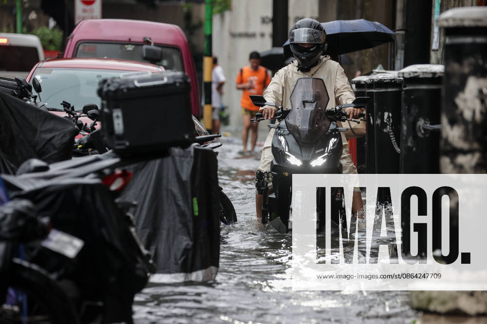 Heavy Rainfall To Continue In Manila A motorcycle wades along a flooded road in Makati City, Manila, Philippines, on August 17, 2026. According to the Philippine Atmospheric, Geophysical, Astronomical and Services Administration s (PAGASA) latest weather forecast, the southwest monsoon will continue to bring heavy rainfall in Luzon, which includes Metro Manila, Ilocos Norte, Batanes, Cagayan, Cordillera Administrative Region, Tarlac, Pampanga, Cavite and Batangas. Makati Philippines