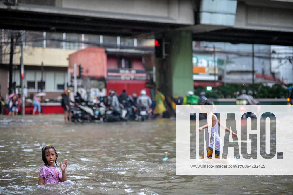 Children playing in the flood water brought by torrential monsoon rains at Taft Ave., Manila, Metro Manila. Two days ago, Metro Manila and neighboring provinces experienced a hot and humid weather. Monsoon rain came back yesterday and persisted throughout the day with flash floods in different areas of the metropolitan. Philippines - ZUMAr240 20260817_zip_r240_002