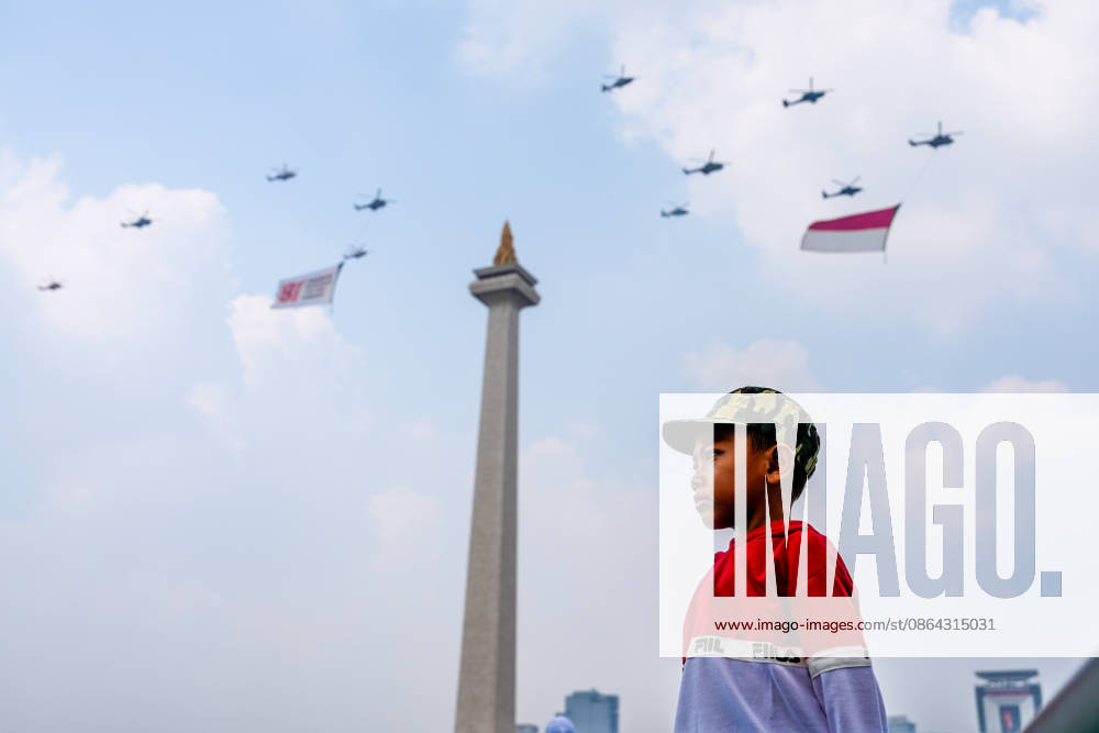 Jakarta, Indonesia:People watch as Indonesian Air Force personnel perform aerial and parachute demonstrations during celebrations marking the 81st anniversary of Indonesia s Independence Day at the National Monument. Jakarta Indonesia - ZUMAm265 20260817_zip_m265_015
