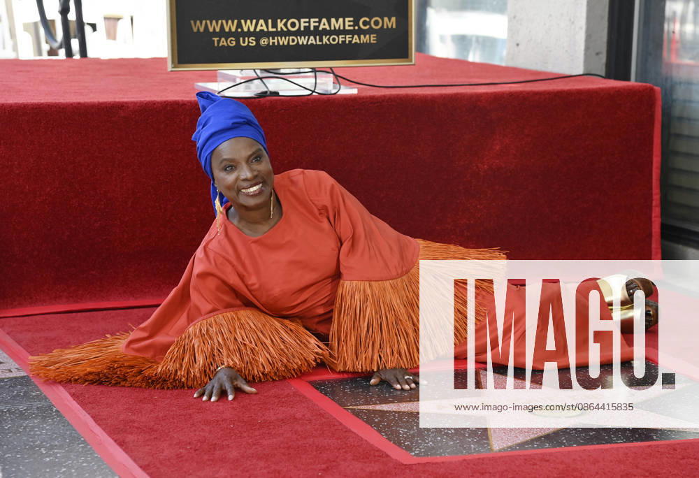 Five-time Grammy-winning Beninese musician, actress, and activist Angelique Kidjo lies beside her star during an unveiling ceremony honoring her with the 2,854th star on the Hollywood Walk of Fame in Los Angeles on Tuesday, August 18, 2026. LAP2026081814 JIMxRUYMEN