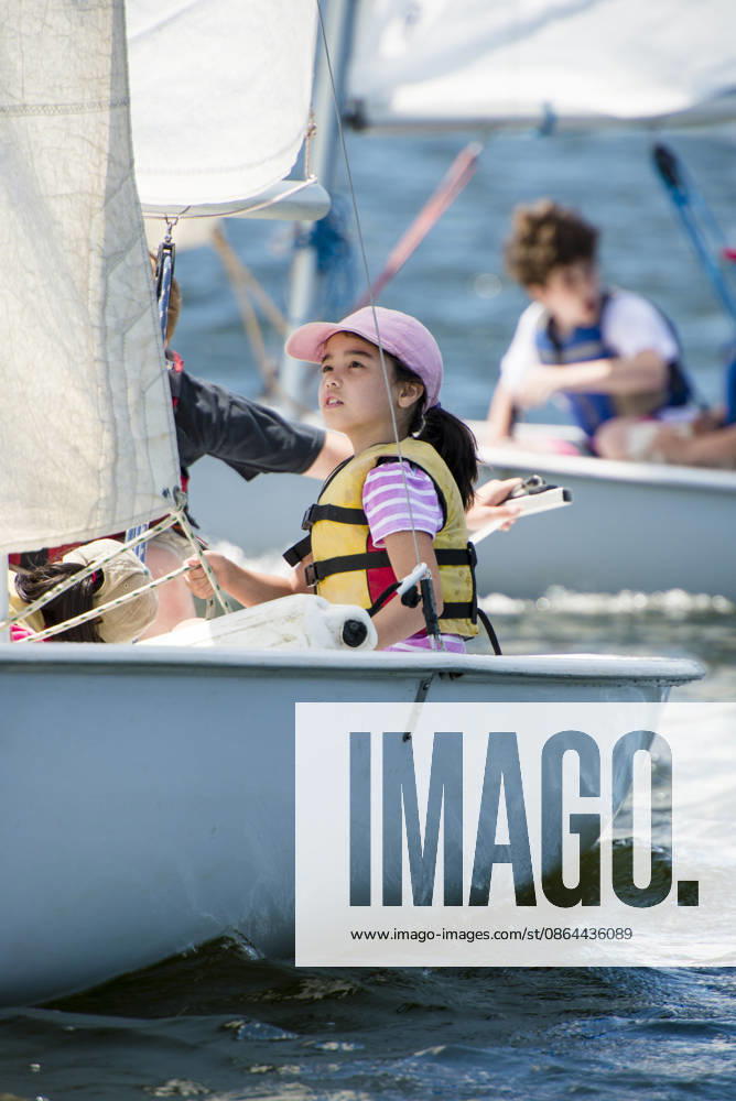 Focused young girl learning to sail a dinghy Providence, Rhode Island, United States CR_CABR260812-2105395-01 ,model released, Symbolfoto ,property released